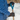Hands gripping a snow shovel handle in Heat Up Mountain heated gloves