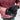 Person wearing black gloves with 'HEAT UP' branding in a snowy setting