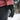 Black glove with 'HEAT UP' branding worn by a person in a snowy outdoor setting.