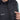 Pressing the heat level button on the chest of the Heat Up men's heated vest