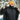 Man in a yellow toque and neck warmer opening his jacket to show the Heat Up men's heated vest