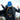 Runner in a cap putting on the Heat Up women's heated vest over a running harness in winter