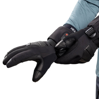 Person pulling on a Heat Up Peak heated glove with leather palm and long cuff