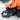 Child scooping up snow with Heat Up Junior heated mittens