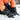 Person wearing heated gloves in a snowy setting