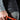 Close-up of the Heat Up logo on the leg of the heated shorts, worn over a base layer
